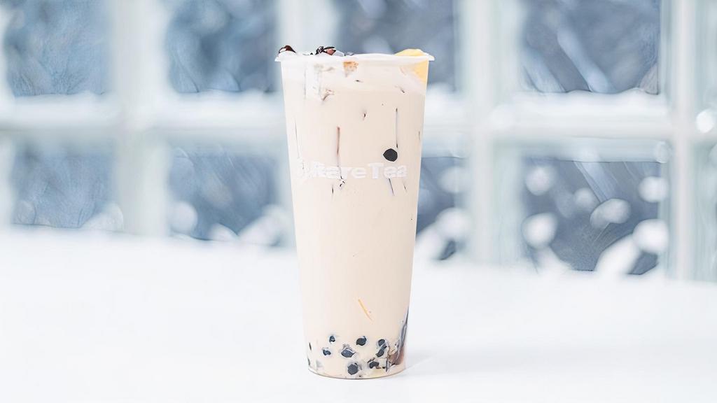 QQ Milk Tea · Classic black milk tea with a little bit of every topping. Toppings include: boba, lychee jelly, pudding, grass jelly and red bean.