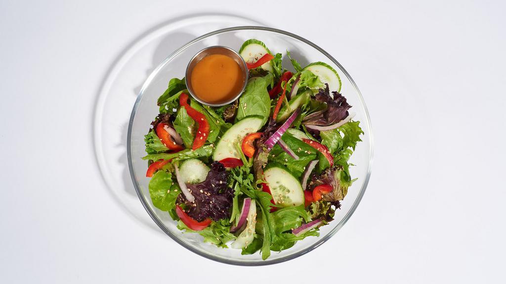 Sesame Ginger Salad · 530-1030 cal.
Spring mix, onions, red bell peppers, and cucumbers topped with sesame seeds.