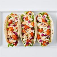 Korean Tacos · 950-960 cal.
Chicken or marinated ribeye over three flour tortillas. Topped with lettuce, co...