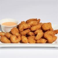 Popcorn Shrimp · 890 cal.
Succulent fried shrimp fried to perfection, served with a spicy mayo dipping sauce.