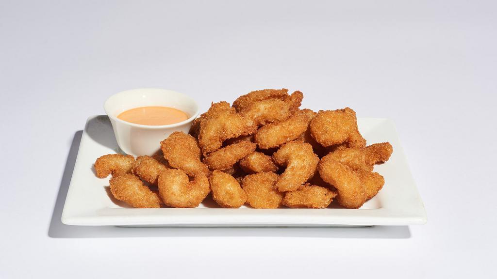 Popcorn Shrimp · 890 cal.
Succulent fried shrimp fried to perfection, served with a spicy mayo dipping sauce.