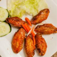 06. Chicken Wings with Fish Sauce Glaze (6 pcs.) · Cánh gà nước mám.