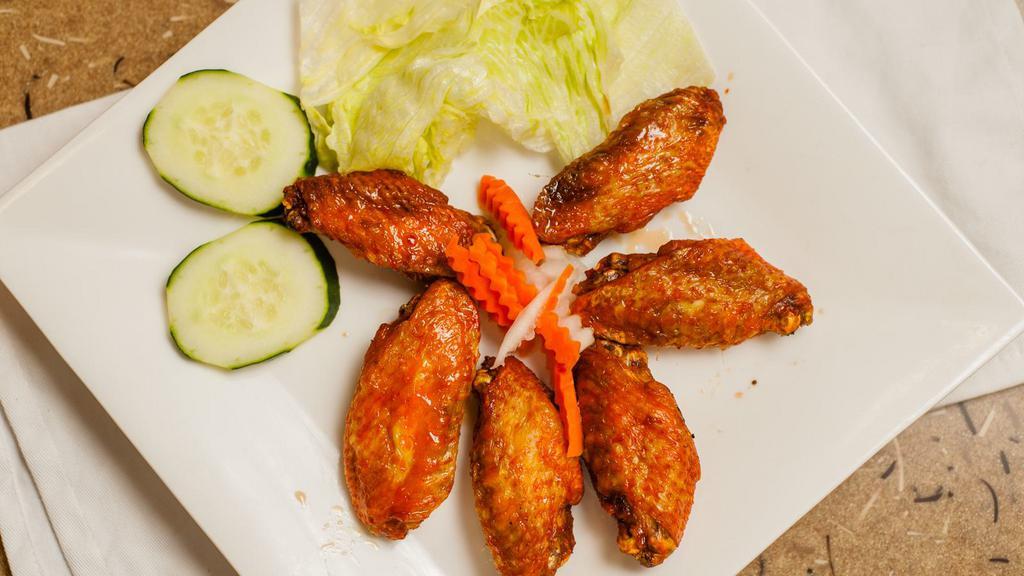 06. Chicken Wings with Fish Sauce Glaze (6 pcs.) · Cánh gà nước mám.