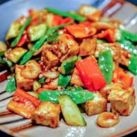 Vegetarian Kung Pao with Tofu · Fresh snap peas, red bell pepper. Zucchini, and water chestnuts sautéed with crispy tofu in ...