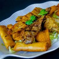 Combination Plate (Serves Two) · Egg rolls, pot stickers, gong's drumsticks, fried prawns and beef satay, crab meat rangoon (...