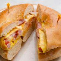 Breakfast Bagel · Egg, ham, swiss cheese, onion and tomato one a plain bagel.