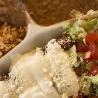Flautas · Fried chicken taquitos (4) topped with cheese and sour cream. Served with beans and rice on ...
