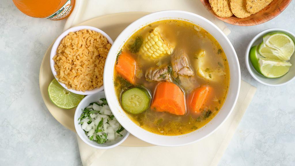 Caldo de Res · Beef soup with vegetables Served with a side of rice and tortillas