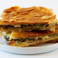 18. Spanakopita · Spinach and Feta cheese wrapped in puff pastry.