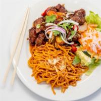 57. Garlic Noodles with Shaking Beef · Choice of meat stir fried with onion, lemon grass, and chili in garlic sauce served with gar...