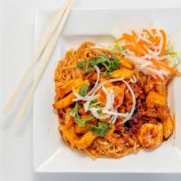 56. Pad Thai · Rice noodle stir fried with chicken, shrimp, egg, tofu, bean sprouts, and topped with peanuts