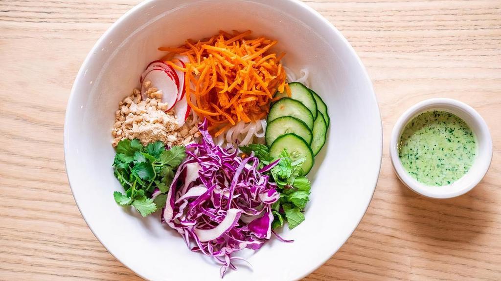 Spring Noodle Bowl · Rice noodles, marinated mushrooms, pickled carrots, red cabbage, cucumber, sliced radish, crushed cashew mix, mint, cilantro, green goddess dressing.