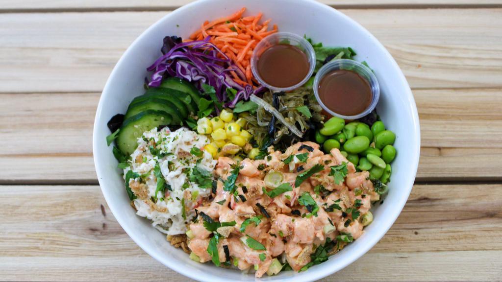 Spicy Shrimp Poke Bowl · Spicy Shrimp served over rice & mixed greens with krab salad, seaweed salad, cucumber, corn, carrot, red cabbage, edamame, crispy onion, furikake and cilantro.