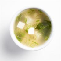 Miso Soup (Vegan) · All natural miso soup with organic tofu, green onion, and wakame seaweed.