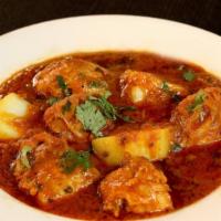 Aloo Vindaloo · Potatoes cooked in special spicy sauce.
