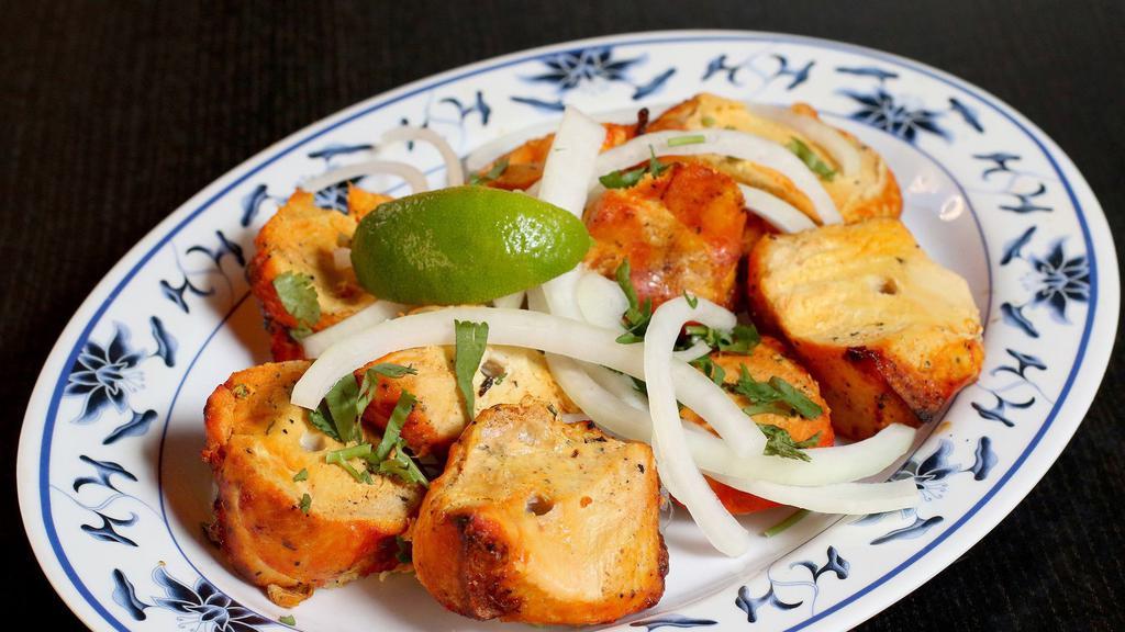 Chicken Boti · Chicken cubes marinated in spices and cooked in clay oven.