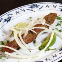 Seekh Kabab · Ground beef marinated in spices on skewers and cooked in clay oven.