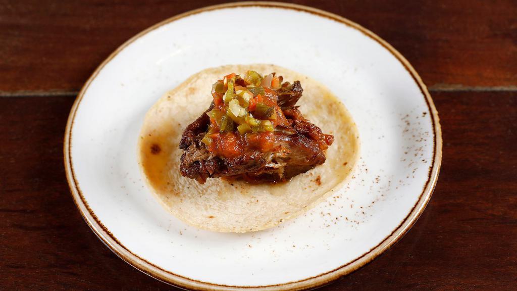 Carnitas · slow roasted pork shoulder, chile fresno salsa, pico de nopal, escabeche