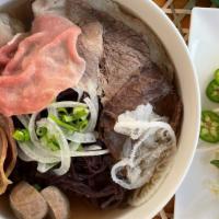 01. Forbidden Pho Combos · Forbidden black rice noodles with top of eye of round steak, well-done flank, well-done bris...