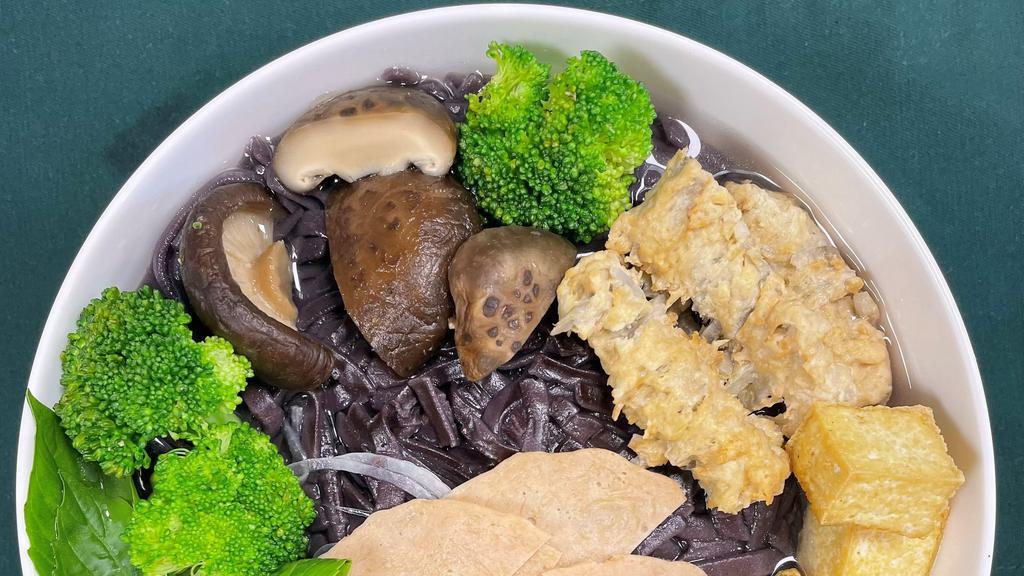 07. Veggie Forbidden Pho · Forbidden black rice noodles with tops of shiitake mushroom, tofu, veggie ham, gobo tempura, carrot, and broccoli.