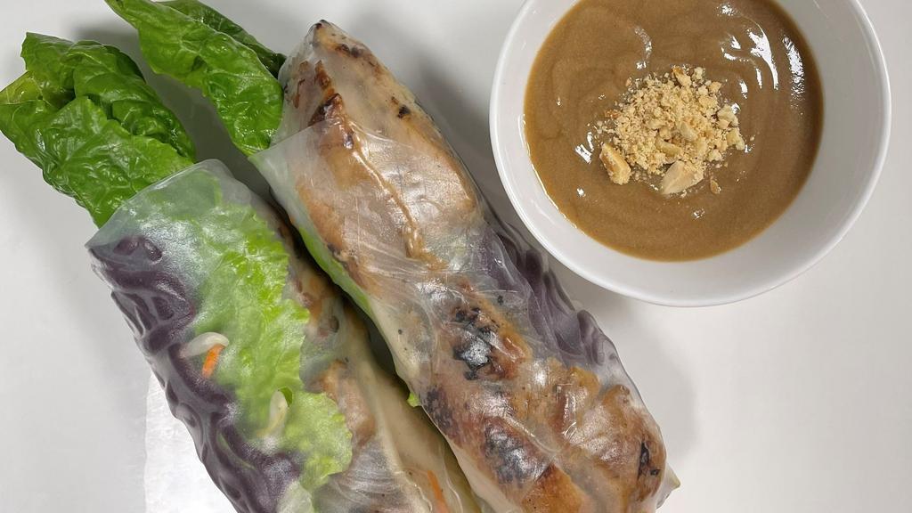 A4. Forbidden Black Rice Grilled Chicken Spring Rolls · Forbidden black rice vermicelli with grilled chicken, Romaine lettuce, bean sprout, mint, cucumber and pickled carrot. Serve with sauce on the side.