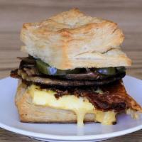 Sausage Egg and Cheese Biscuit Sandwich · Sausage, slow cooked egg, cheddar cheese , onion jam and pickled jalapeños  on a biscuit wit...