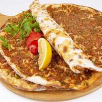 Lahmacun Mild (1 piece) · Lahmacun is a round, thin piece of dough topped with minced meat, minced vegetables and herb...