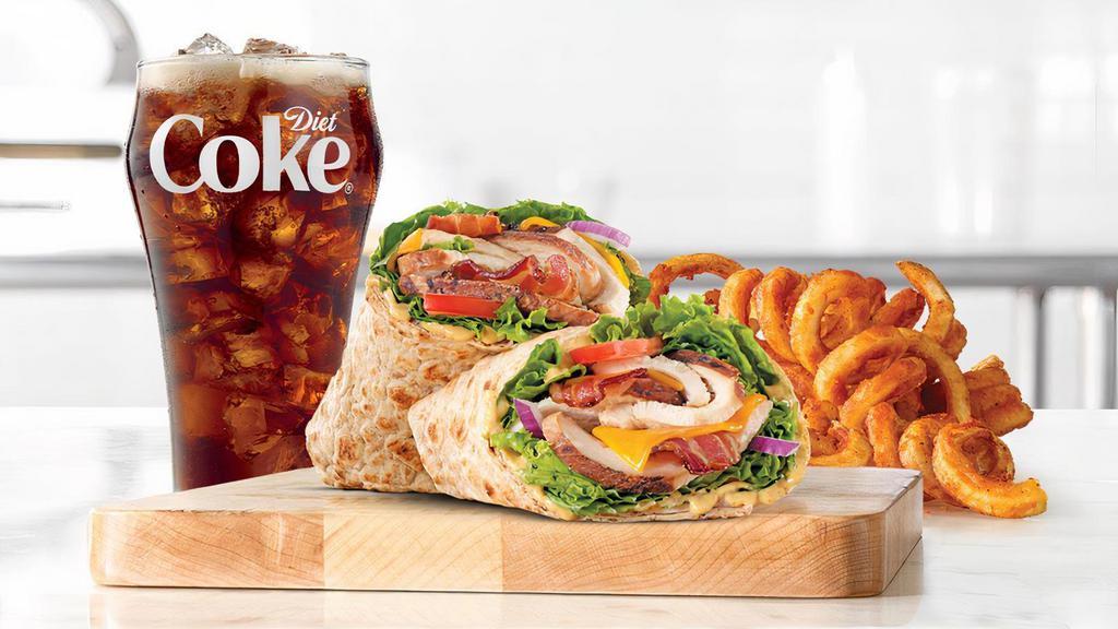 Chicken Club Wrap · Slow roasted chicken breast with bacon, natural cheddar cheese, green leaf lettuce, red onion, honey mustard sauce, and tomato in an artisan wheat wrap. Visit arbys.com for nutritional and allergen information.