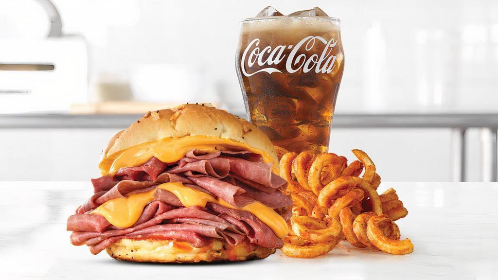 Double Beef 'N Cheddar · Two times the amount of thinly sliced roast beef than the Classic, with warm cheddar sauce and zesty red ranch sauce on a toasted onion roll.  Visit arbys.com for nutritional and allergen information.