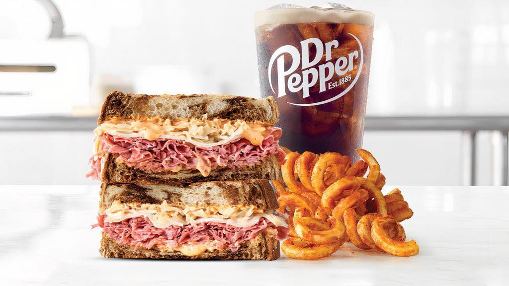 Reuben · Thinly sliced corned beef with melted Swiss cheese, tangy sauerkraut and creamy Thousand Island dressing on toasted marble rye bread.Visit arbys.com for nutritional and allergen information.
