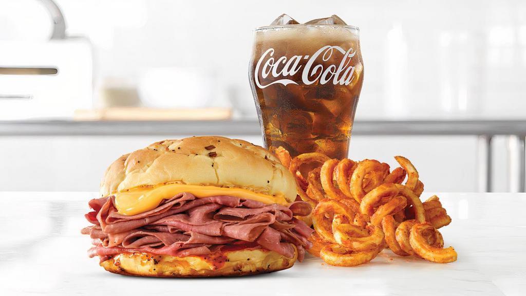 Classic Beef 'N Cheddar · Thinly sliced roast beef with warm cheddar sauce and zesty red ranch sauce on a toasted onion roll. Visit arbys.com for nutritional and allergen information.