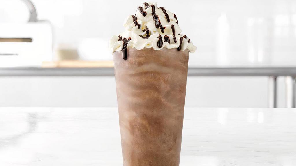 Chocolate Shake · A rich & creamy chocolate shake made with Ghirardelli® chocolate, and topped with whipped cream and a Ghirardelli chocolate drizzle. Visit arbys.com for nutritional and allergen information.