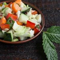 Kachumbar Salad · Vegan. Fresh chopped raw vegetables with a light citrus dressing.