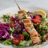 Grilled Salmon Salad · Mixed fresh greens, seasonal vegetables, cherry tomatoes & shredded cabbage, topped with gri...