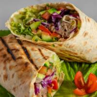 Kefta Kebab Wrap · Grilled seasoned ground lamb & beef with hummus, tomatoes & lettuce topped with tahini, wrap...