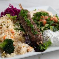 Kefta Kebab Plate · Seasoned ground lamb and beef skewer and skewer of grilled vegetable plus sides. Comes with ...