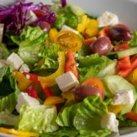 Small Greek Salad  · Lettuce, tomatoes, cucumbers, Kalamata olives, shredded feta cheese, topped with house vinai...