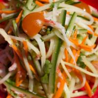 Green Papaya Salad · Gluten-free. Shredded green papaya carrots, English cucumbers, cherry tomatoes, tossed in a ...