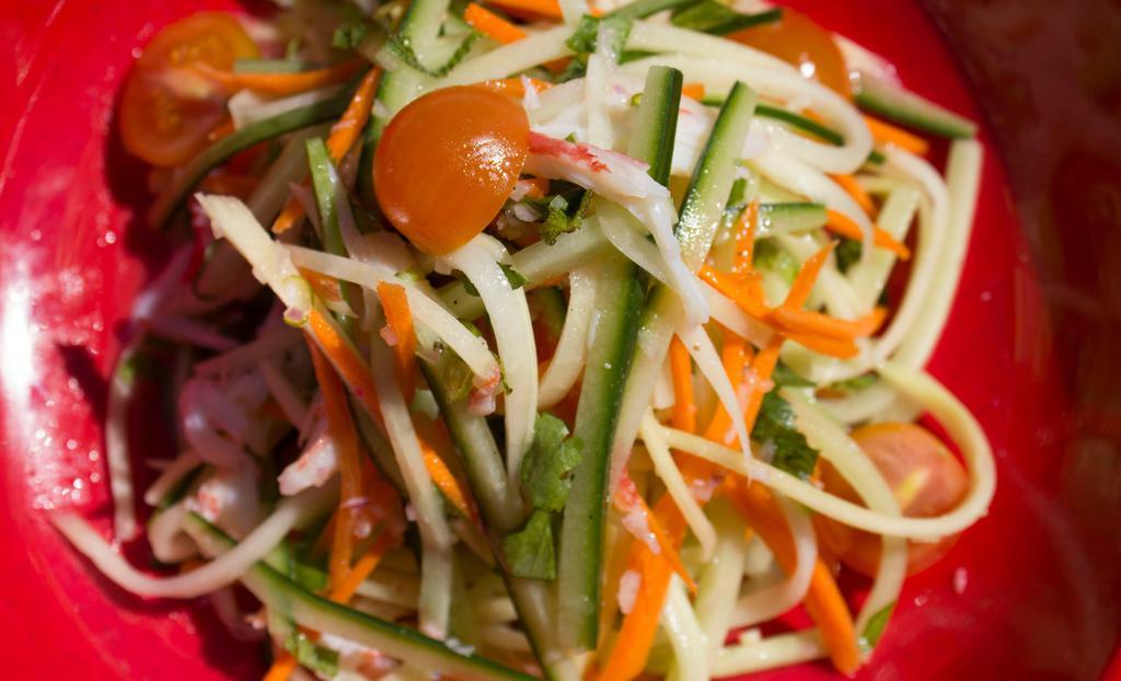 Green Papaya Salad · Gluten-free. Shredded green papaya carrots, English cucumbers, cherry tomatoes, tossed in a house made lime vinaigrette.
