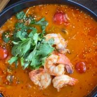 6. Tom Yum Soup (Thailand) · Spicy. Spicy and sour housemade shrimp broth, tomato, fresh herbs, sweet onion, vermicelli r...