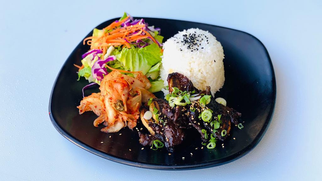 13. Kalbi Short Rib Plate · Korean short ribs, side salad, kimchi, served with steamed rice.