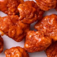 Boneless Wings · Delicious breaded pieces of tender boneless chicken tossed in your choice of sauce. Served w...