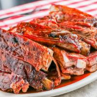 Slab of Ribs · This is not your small individual portion; this portion feeds three-four people. When we say...