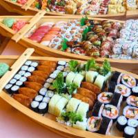 Family Boat · Sample  photos, actually food food may vary. Select up to 3 entree items and an option of su...