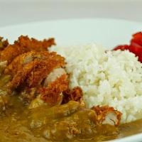 Katsu Curry · Curry sauce over rice with pork cutlet.