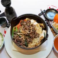 Sukiyaki · Thinly sliced beef with vegetables in the soup.