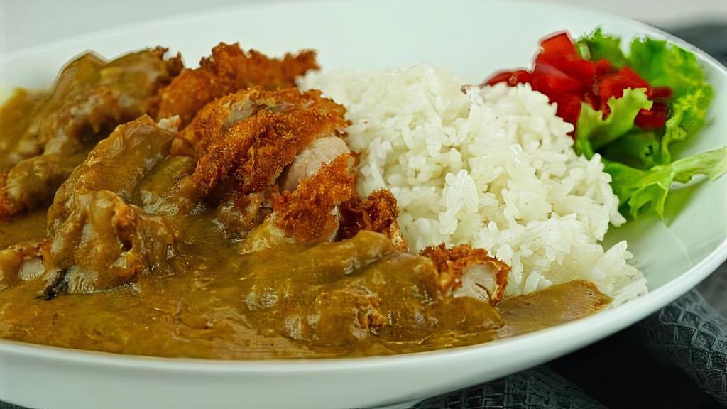Ebi Curry · Curry sauce over rice with deep-fried shrimp.