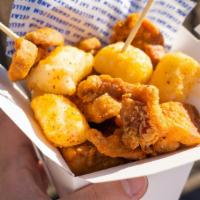 Sunday Birdies · Popcorn chicken w/ fried rice cakes and tossed in Kimchi salt.