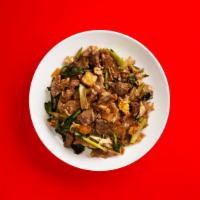 Spicy Pad See Ew · Light noodles cooked with dark sauce - in all things, duality.