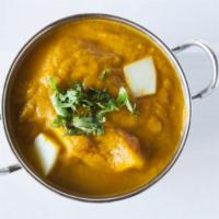 Chicken Curry · Boneless chicken cooked in delicately spiced curry sauce.